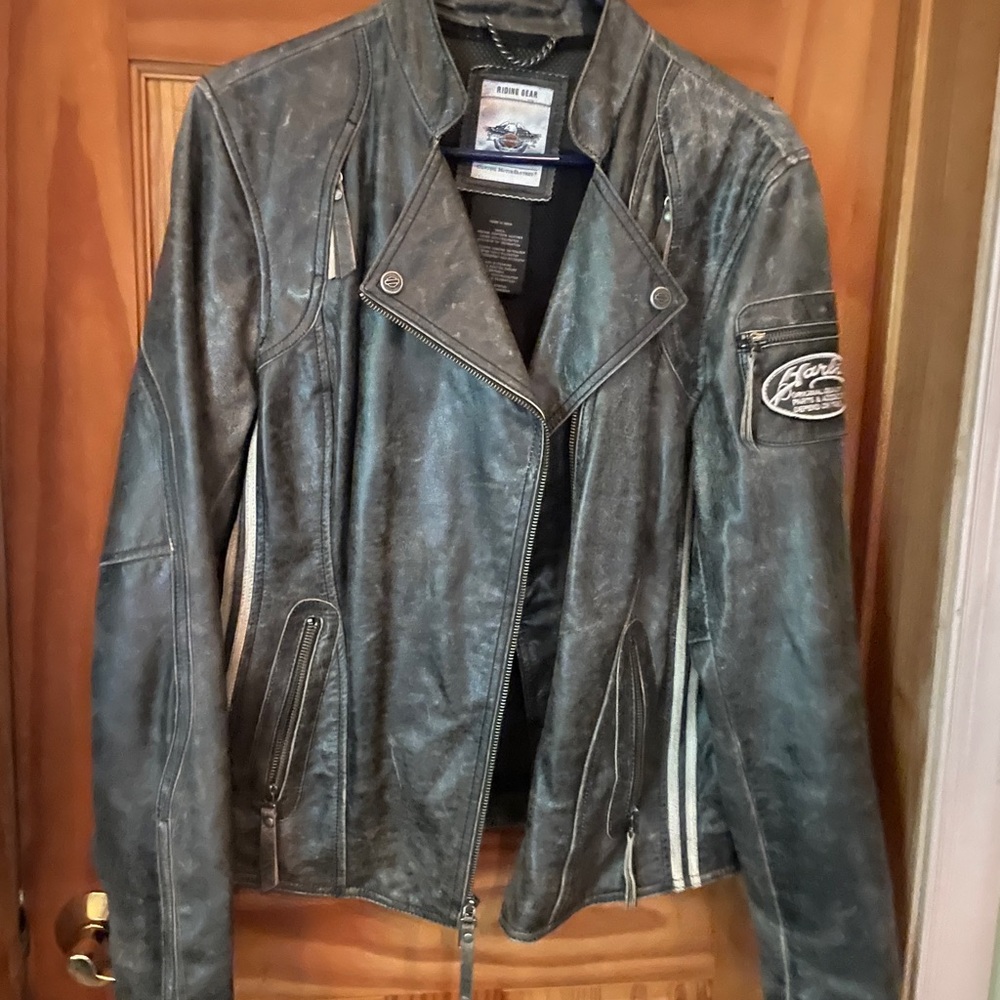 Harley Davidson Women's Black Leather Jacket with white striped. Many pockets.